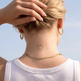 Strahlendes Herz Tattoo
