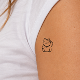 Süße Winkekatze Tattoo