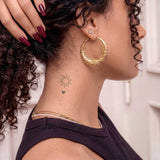 Sonne und Herz Ornament Tattoo